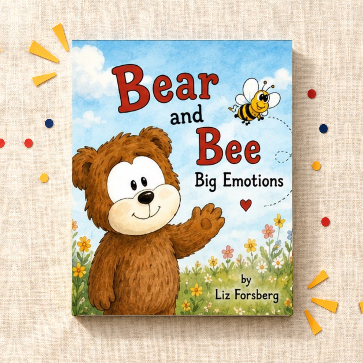 Bear and Bee hardcover lying on cream linen with paper confetti